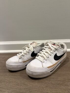 Nike White Sneakers with Black Swoosh and Tan Trim